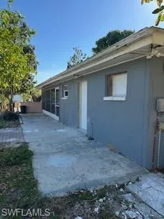View of home's exterior with a patio area and stucco siding