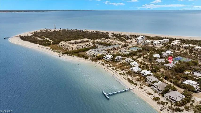Drone / aerial view featuring a water view and a beach view