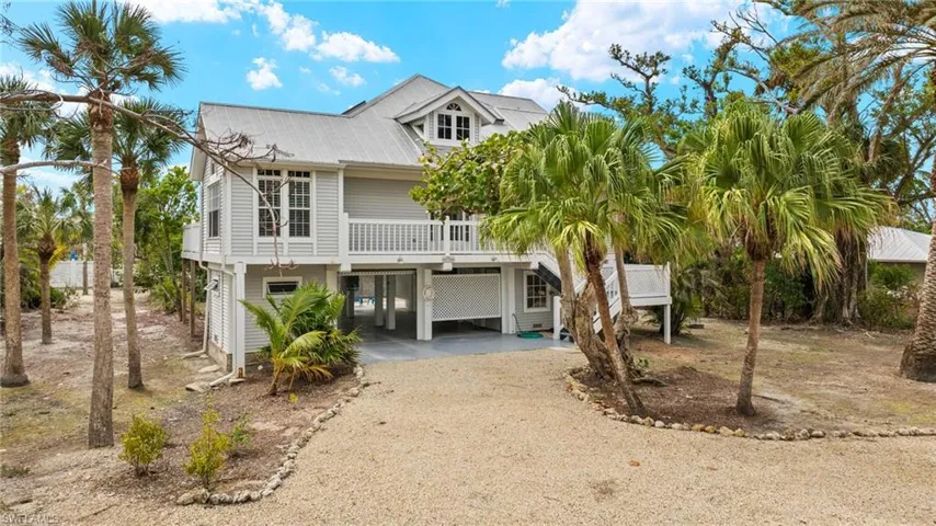 Coastal inspired home with a carport