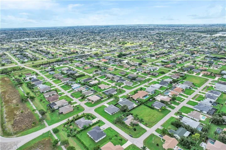 View of property location with nearby suburban area