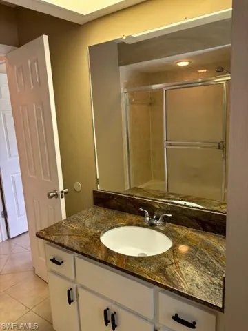 Bathroom with vanity and tile patterned flooring