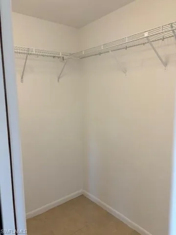 Spacious closet with tile patterned flooring