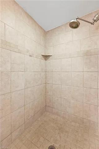 Bathroom featuring tiled shower