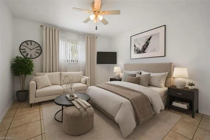 Bedroom featuring light tile patterned flooring and ceiling fan