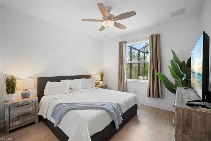 Bedroom featuring light wood-type flooring and ceiling fan
