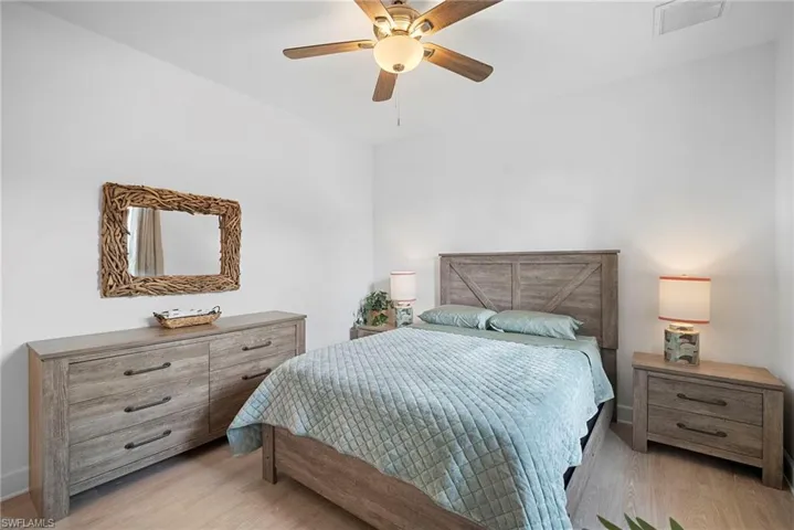 Bedroom featuring light wood-type flooring and ceiling fan