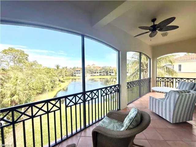 Sunroom with a water view