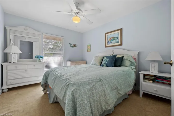 Bedroom featuring carpet flooring and ceiling fan