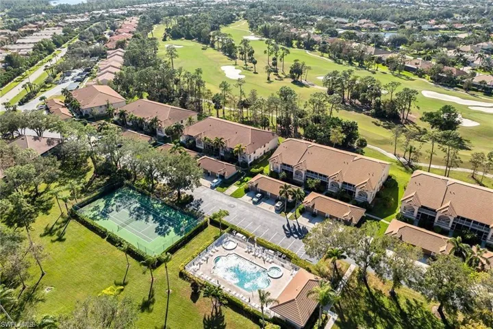 View of property location featuring nearby suburban area and a golf course