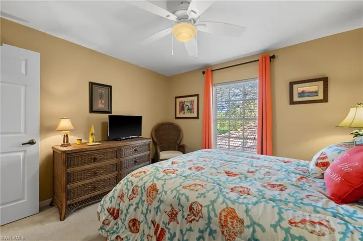 Bedroom with carpet flooring and a ceiling fan