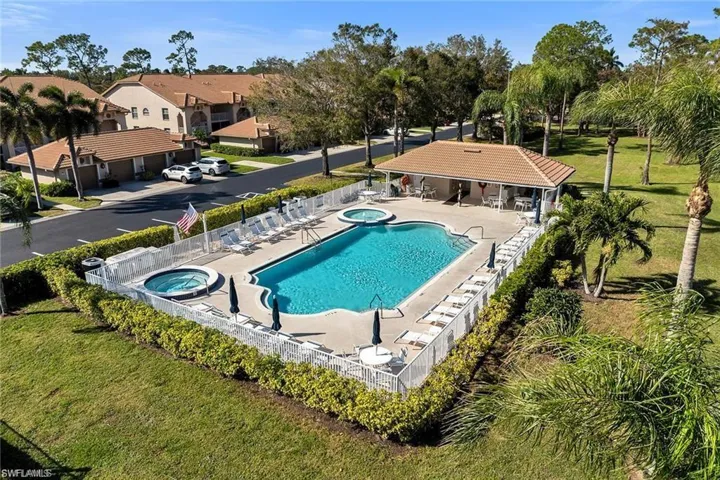Community pool with a community hot tub and a patio