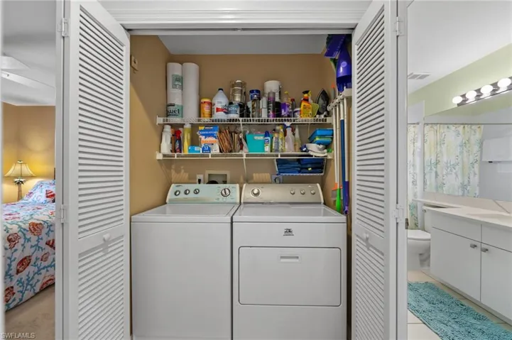 Laundry room featuring separate washer and dryer