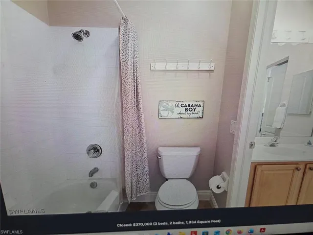 Full bathroom with vanity and shower / tub combo