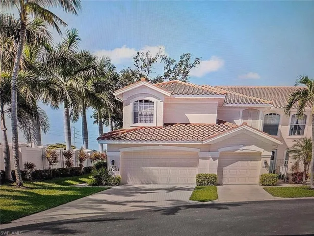 Mediterranean / spanish home with a tiled roof, concrete driveway, and stucco siding