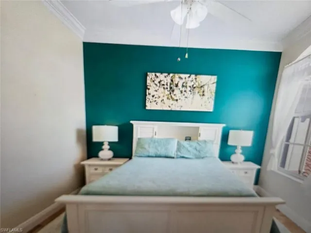 Bedroom with crown molding and ceiling fan