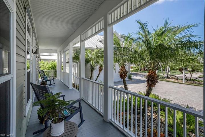 Sitting area on front porch with breezeway to garage