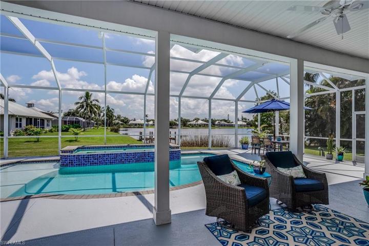 Under Truss seating area on lanai, looking out to lake