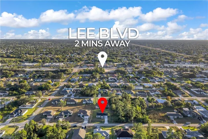 Aerial view of property's location with nearby suburban area