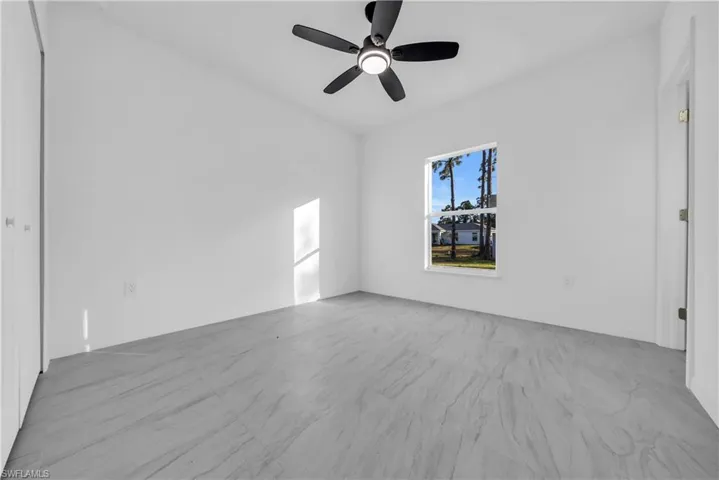 Spare room with a ceiling fan