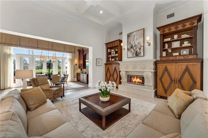 The fireplace is flanked by custom, bespoke cabinetry to house a TV and all your treasures.