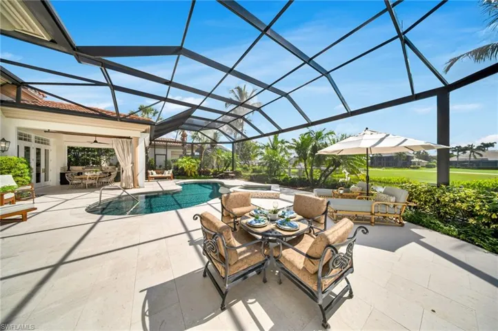 The expansive lanai is the perfect place to relax and entertain, with a fabulous, outdoor kitchen and dining area.