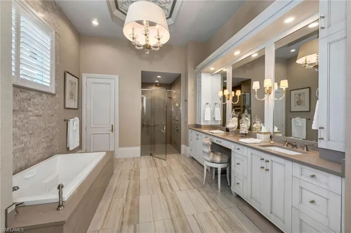 Designer re-designed Primary bath which includes quartz counters, oversized tub with custom handles, new light fixtures, huge shower...Spa-inspired designer and functional details that make this bath a haven...