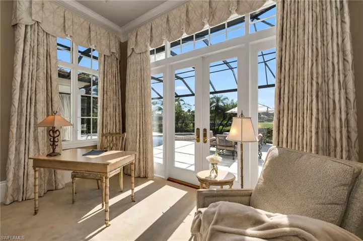 Sitting area with private views to the large pool, lanai, lake and Palm Course...