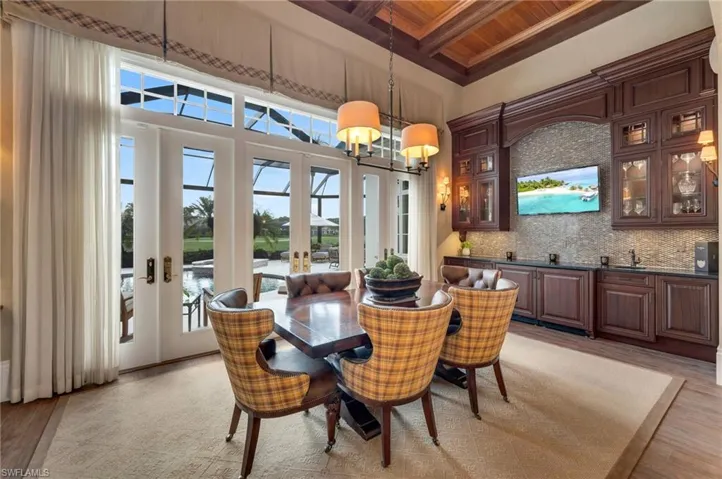 The family room has a custom bar with two refrigerators and a second dishwasher.  The views to the outside are spectacular!