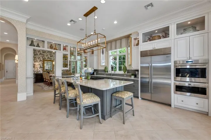 Whip up your specialties in this chef's kitchen, which includes a Sub-Zero refrigerator, Wolf wine refrigerator, Wolf wall ovens...