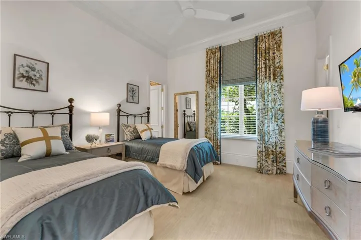 One of three guest suites;  this one with high ceilings, huge, walk-in, custom closet, so plenty of storage space for your guests!