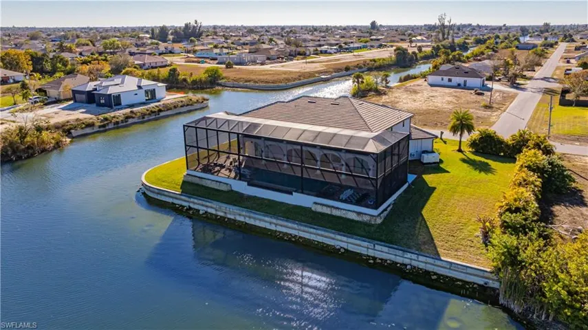 Aerial perspective of suburban area with a nearby body of water
