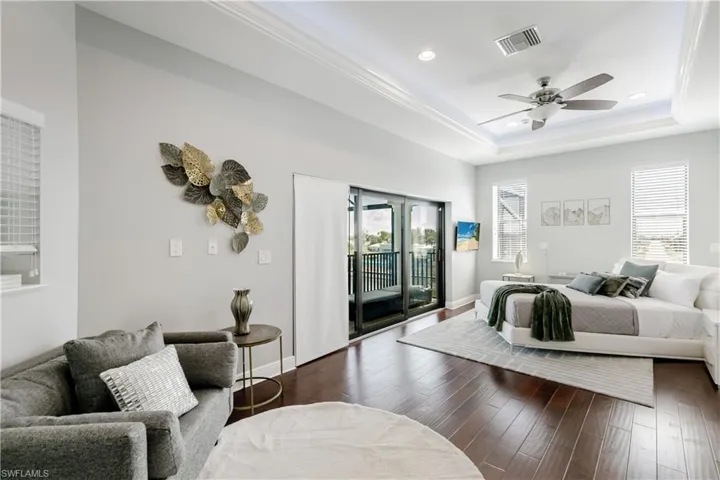 Bedroom featuring hardwood / wood-style flooring, access to outside, ceiling fan, and recessed lighting
