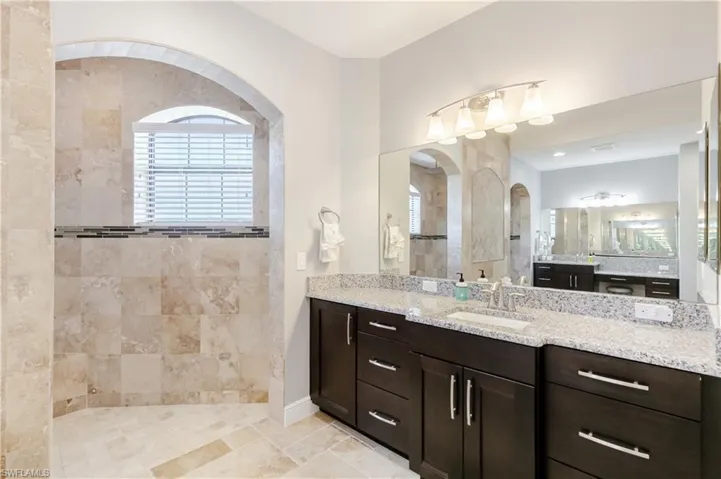 Full bathroom with vanity and a walk in shower