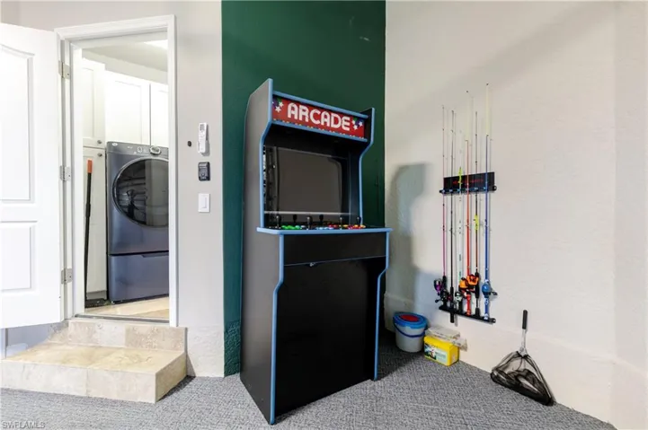 Laundry room with washer / dryer, carpet floors, and cabinet space