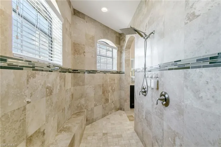 Full bath featuring a tile shower