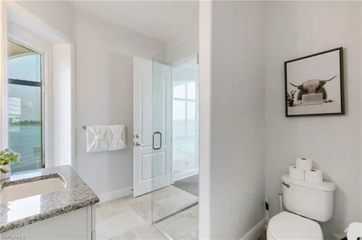 Full bathroom with a shower stall and vanity