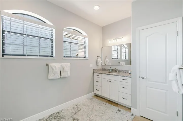 Bathroom with vanity and light tile patterned floors
