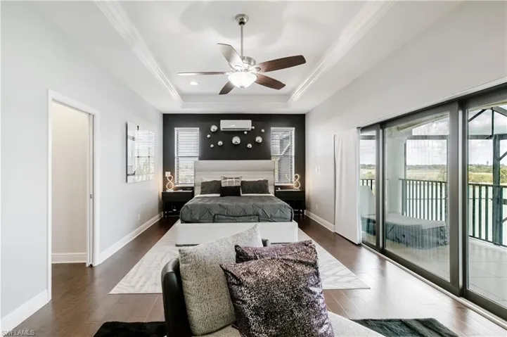Bedroom with access to exterior, dark wood-style floors, ceiling fan, and crown molding