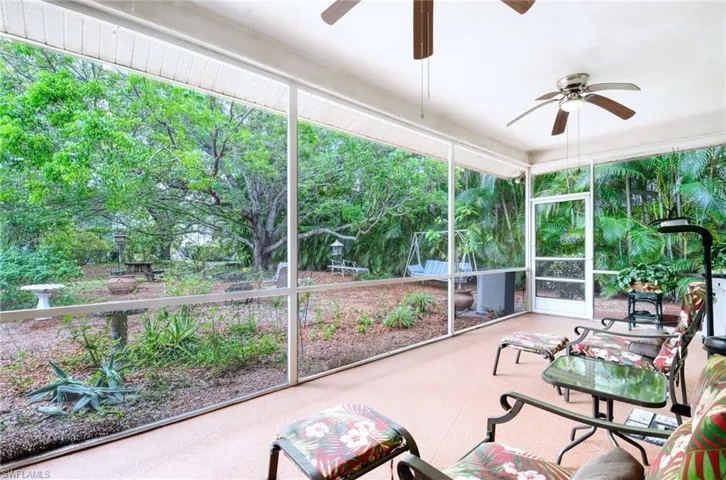 Sunroom / solarium featuring a ceiling fan