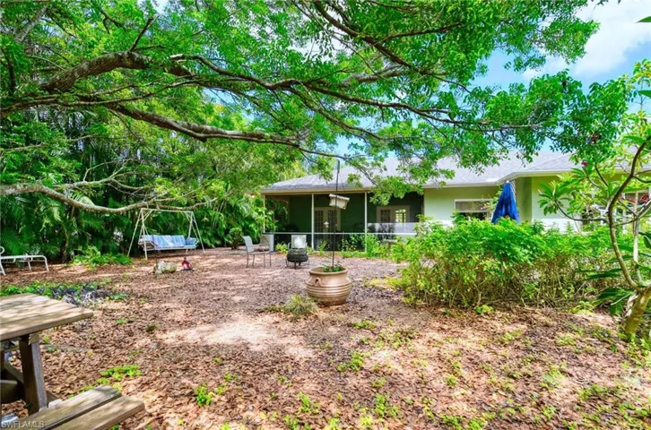 View of yard featuring a sunroom