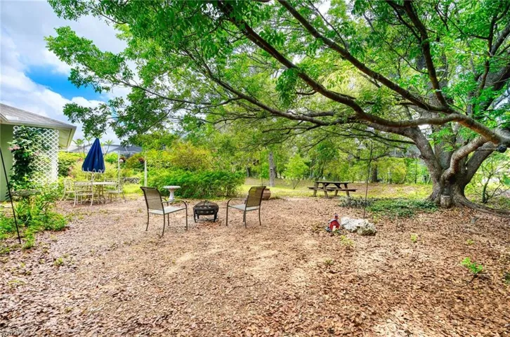 View of yard with an outdoor fire pit