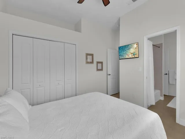 Bedroom featuring a closet and a ceiling fan