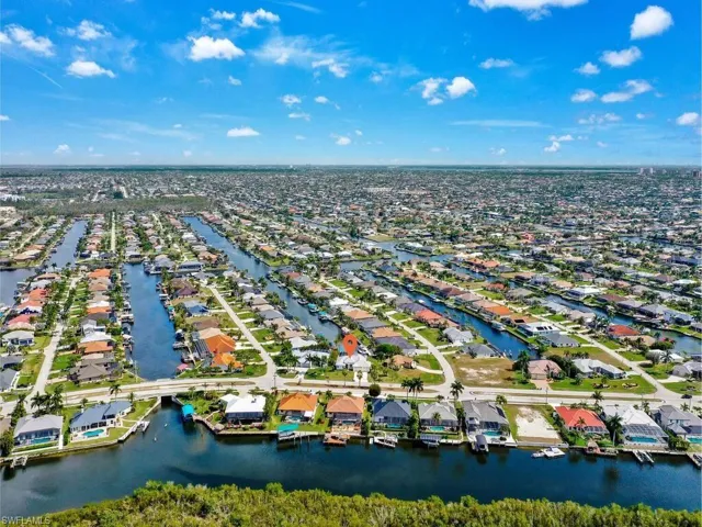 View of property location with nearby suburban area and a large body of water