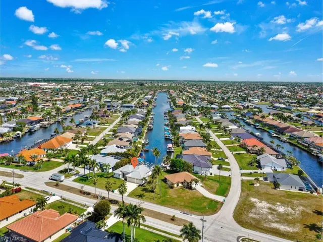 Aerial perspective of suburban area with a large body of water