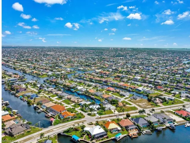 Aerial perspective of suburban area with a nearby body of water