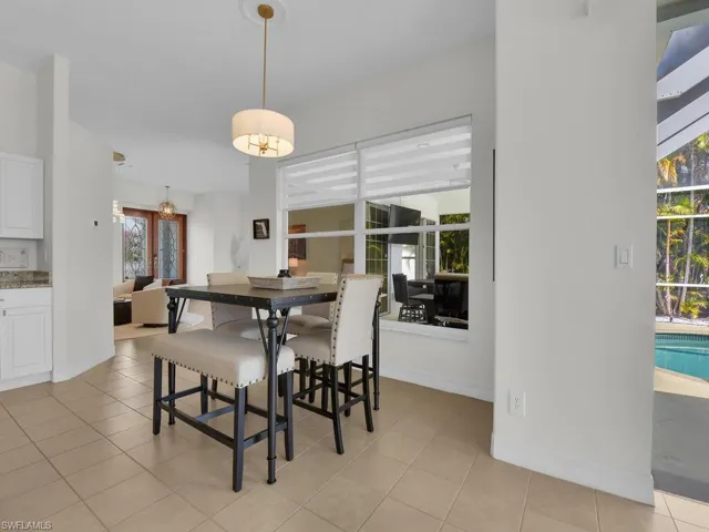Dining room with light tile patterned floors