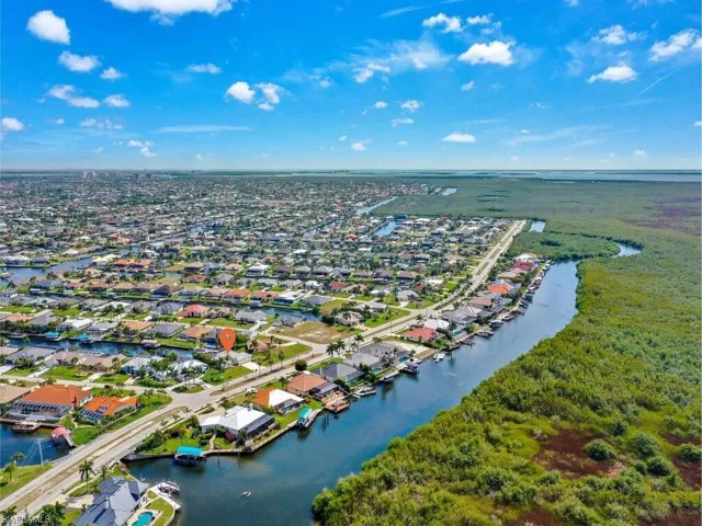 Aerial perspective of suburban area with a nearby body of water
