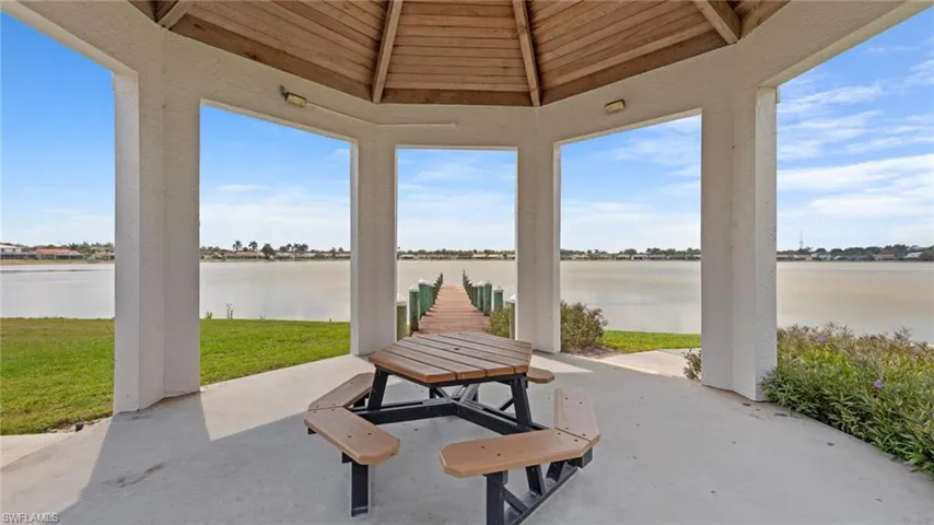 View of patio with a water view