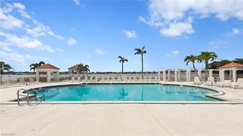 Community pool featuring a gazebo, fence, and a patio area