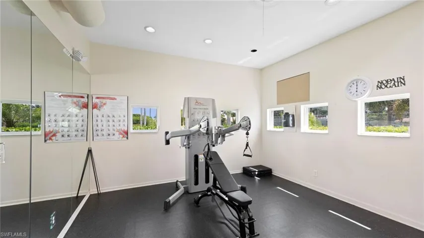 Workout room featuring recessed lighting and baseboards